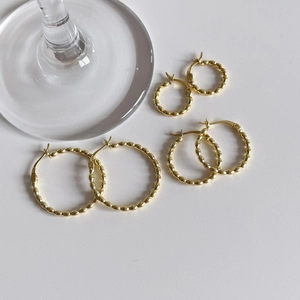 Detailed set of three S925 sterling silver gold beaded hoop earrings in various sizes