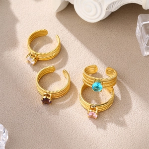 Detailed view of adjustable gold-plated rings with colorful square zircon stones