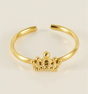 Detail of a minimalist gold crown adjustable ring with a polished metallic finish