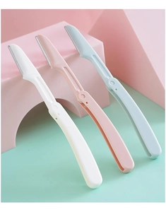 Three-piece set of folding eyebrow razors in pink, white, and blue with sharp metal blades