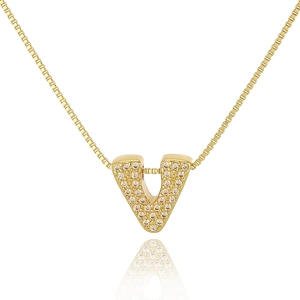 Macro shot of gold V-letter pendant with micro-pave sparkling crystals on box chain