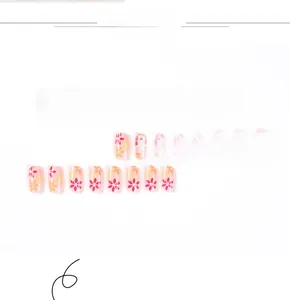 Detailed view of 24pcs pink press-on nails with French tips and floral designs