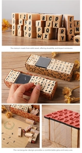 Close-up of wooden alphabet stamps with rubber heads for DIY journaling and scrapbooking