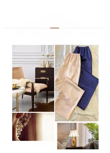 Details von Seidensatin-Loungehosen in Champagner und Navy mit Hochglanz-Finish