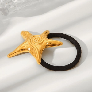 Golden starfish hair tie with stainless steel finish on black elastic band with shadows