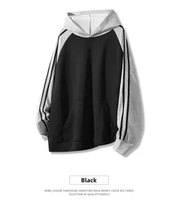 Detail view of contrast sleeve hoodie with side stripes and casual loose fit design