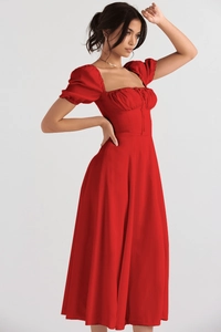 Close-up of red French style midi dress featuring puff sleeves and square neckline