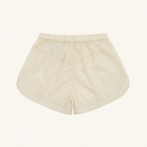 Flat lay detail of cream jogger shorts featuring lightweight textured viper alloy skin fabric