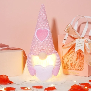 Glowing Valentine's Day gnome with heart hat and LED lights in gift setting