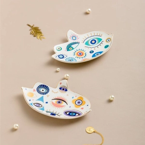 Vassoio per gioielli creativo in ceramica a forma di occhio con bordo dorato artistico