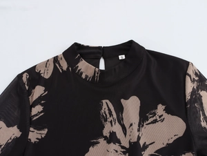 Detail of mock neck mesh top with abstract floral print and back neck opening detail