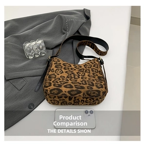 Detailed view of leopard print hobo bag showing size scale next to a smartphone