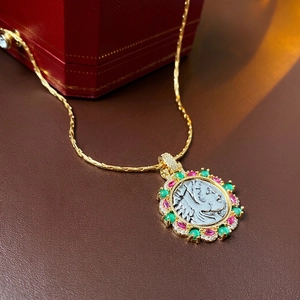 Vintage gold plated coin pendant necklace with red and green stones and zircon accents