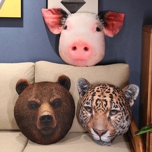 Realistic animal head plush pillows featuring panda, pig, and leopard designs on sofa