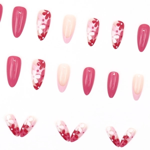 Almond-shaped French press-on nails with rose red floral patterns and glossy finish