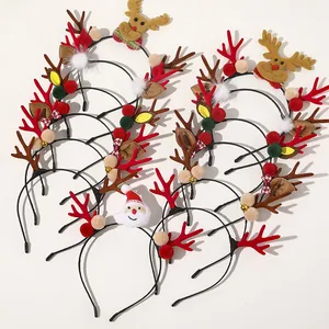 Detailed view of various Christmas reindeer antler headbands with plush decorations
