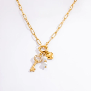 Gold stainless steel link necklace with vintage key, heart, and pearl pendants