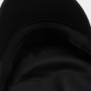 Detail of internal black cap structure showing sweatband and reinforced brim stitching