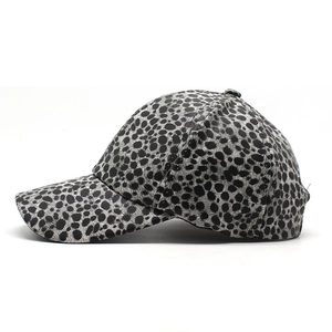 Detail of grey leopard print baseball cap made of premium textured PU leather material