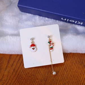 Asymmetric Christmas earrings featuring Santa Claus and candy cane with faux pearls