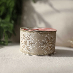 Merry Christmas gold snowflake velvet ribbon in beige for holiday gift wrapping