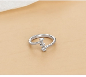 Macro shot of S925 sterling silver ring featuring a letter I with cubic zirconia inlay