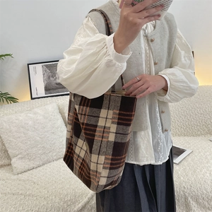 Close-up of vintage wool plaid tote bag with brown checkered pattern and large capacity