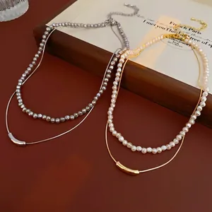 Minimalist double-layer irregular pearl necklace with gold and silver metallic snake chain