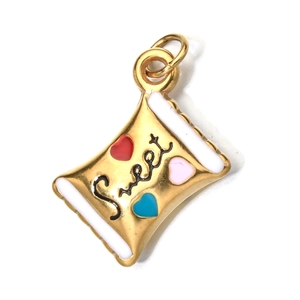 Macro shot of gold pillow-shaped metal pendant with Sweet text and colorful enamel hearts