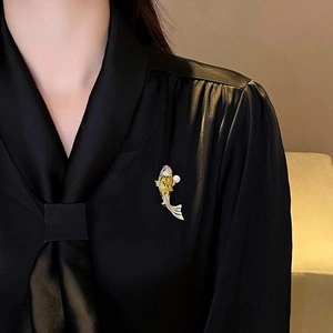 14K gold plated koi fish brooch with sparkling zircons and a pearl on black satin