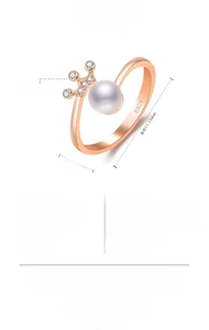 Macro detail of rose gold crown ring featuring a central pearl and S925 engraved band