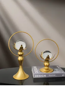 Detail of elegant gold metal lotus stand with crystal ball in new Chinese style decor