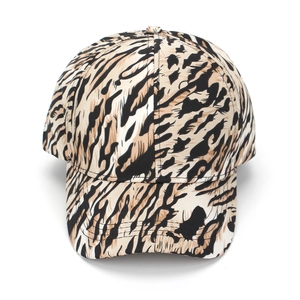 Detailed view of leopard print baseball cap with premium canvas texture and curved brim