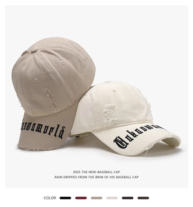 Detailed macro shot of gothic letter embroidery and distressed fabric on a baseball cap