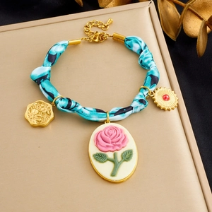 Blue leopard silk ribbon bracelet with vintage gold heart and floral resin pendants