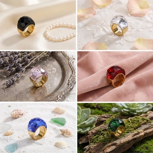 Collage of multi-color crystal rings with geometric facets and 18k gold plated bands