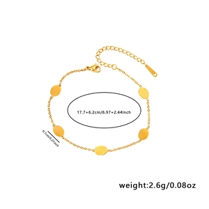 Detailed view of gold stainless steel bracelet with oval charms and lobster clasp