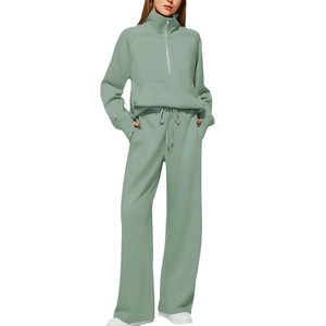 Mint green two-piece set featuring half-zip sweatshirt and high-waist wide-leg sweatpants