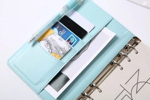 Detail of light blue PU leather notebook cover with card slots and 6-ring binder