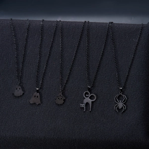 Detail of five black Halloween necklaces featuring ghost, wizard, cat, and spider pendants