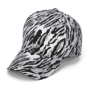 Detail view of stylish leopard print baseball cap featuring textured silver-black tiger stripes