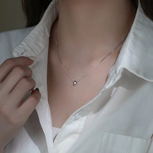 Elegant S925 sterling silver minimalist bean pendant necklace for women shown on model