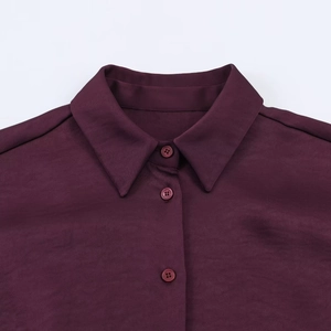 Women's burgundy long sleeve satin blouse with lapel collar and button-down front detail