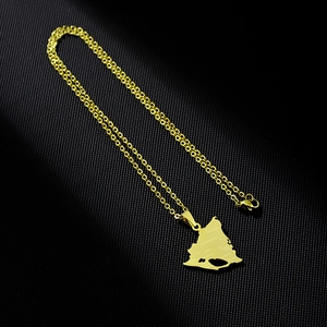 Detailed view of a gold Nicaragua map pendant with engraved cities and polished chain