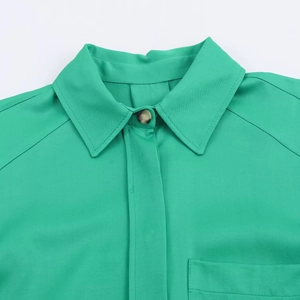Women's bright green satin textured shirt with lapel collar and pocket detail