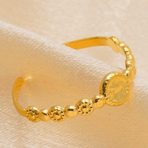 Minimalist 18K gold plated stainless steel open ring with floral relief on silk background