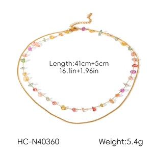 Detail view of gold double-layer necklace with colorful beads showing 41+5cm length specs