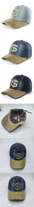 Détail de casquette denim délavé avec logo dollar en strass et bordure dorée cloutée
