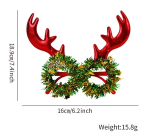 Detailed view of red reindeer antler Christmas glasses with Merry Christmas gold text