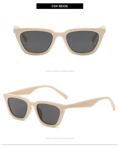 Detail view of retro beige cat-eye sunglasses with dark grey lenses and smooth resin finish